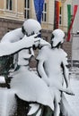 Statue of old man a teaching something the boy