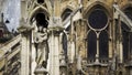 Statue of Our Lady in front of facade of famous Notre-Dame de Paris cathedral