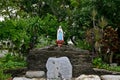 Statue of Our lady of grace virgin Mary view with natural background in the rock cave at Thailand Royalty Free Stock Photo