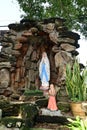 Statue of Our lady of grace virgin Mary view with natural background in the rock cave at Thailand.