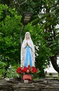 Statue of Our lady of grace virgin Mary view with natural background in the rock cave at Thailand Royalty Free Stock Photo