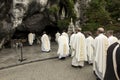 Statue of Our Lady of Immaculate Conception with a rosary in the Grotto of Massabielle in Lourdes Royalty Free Stock Photo