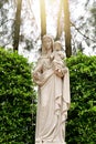 Statue of Our lady virgin Mary with Child Jesus located in front of the catholic church with natural background, Thailand. Royalty Free Stock Photo