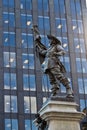 Statue of Paul de Chomedey with modern building background