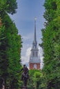 Statue of Paul Revere and spire of Old North Church between tree Royalty Free Stock Photo