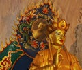 A statue in Perak cave temple with a head of another statue reflected by a mirror Royalty Free Stock Photo