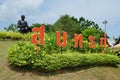 Statue of Phra Sunthonwohan with Thai language name sign in Rayong