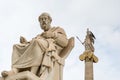 Statue of Plato and goddess Athena against cloudy sky, Athens, Greece