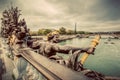 Statue on Pont Alexandre III bridge in Paris, France. Seine river and Eiffel Tower.