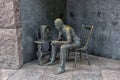 Statue of poor man listening to radio