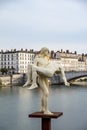 Statue portraying a man holding himself