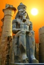 Statue of Ramesses II at sunset. Luxor Temple, Egypt