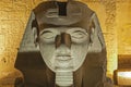 Statue of Ramses II head at entrance to Luxor Temple during night Royalty Free Stock Photo