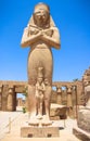 Statue of Ramses II with his daughter Merit-Amon in the temple of Amun-RA (the temple of Karnak in Luxor) Royalty Free Stock Photo
