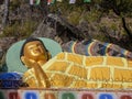 Statue representing Shakyamuni Buddha lying on his right side