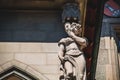 Statue of the right side of the Town hall building of Bern Switzerland that depicts lie and cowardice Royalty Free Stock Photo