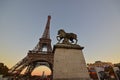 Statue Roman Warrior Horse with Eiffel Tower & Moving Carousel during sunset