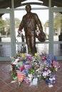 Statue of Ronald Reagan with flowers and gifts at the Ronald W. Reagan Presidential Library