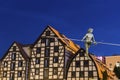 Statue on the rope and old Granaries in Bydgoszcz, Poland