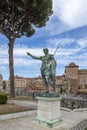 Statue S.P.Q.R. IMP CAESARI NERVAE F TRAIANO OPTIMO PRINCIPI on street Via dei Fori Imperiali, Rome, Italy Royalty Free Stock Photo