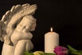 Statue of sad angel as symbol of pain, fear and end of life. Remembrance concept Royalty Free Stock Photo