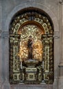 Statue of the Saint Anthony of Padua holding an infant in the Church of Santa Maria, Lisbon. Royalty Free Stock Photo