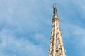 Statue of Saint Eulalia, patron saint of the city, on the spire of the Metropolitan Cathedral Basilica of Barcelona, located in Royalty Free Stock Photo