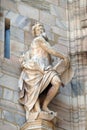 Statue of Saint on the facade of the Milan Cathedral, Duomo di Santa Maria Nascente, Milan, Italy Royalty Free Stock Photo