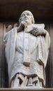 Statue of Saint on the facade of Saint Augustine church in Paris