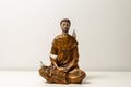 Statue of Saint Francis of Assisi. Statuette of Saint Francis of Assisi meditating. Padmasana pose. Lotus asana. Asana Padmasana Royalty Free Stock Photo