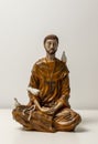 Statue of Saint Francis of Assisi. Statuette of Saint Francis of Assisi meditating. Padmasana pose. Lotus asana. Asana Padmasana Royalty Free Stock Photo