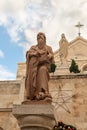 Statue of Saint Jerome in front of the entrance to Chapel of Saint Catherine, near to the Church of Nativity in Bethlehem in the