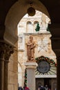 Statue of Saint Jerome in front of the entrance to Chapel of Saint Catherine, near to the Church of Nativity in Bethlehem in the