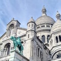 Statue of Saint Joan of Arc contrasting the travertine limestone on the Basilique du SacrÃÂ©-CÃâur in Paris, France. Royalty Free Stock Photo