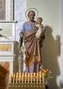 Statue of Saint Joseph holding Jesus in the Church of Santa Maria Maddalena in Castiglione del Lago, Italy.