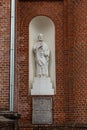 Statue of the Saint Peter on the Church of the Ascension of Christ in Utena, Lithuania Royalty Free Stock Photo