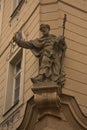 Statue of Saint Peter holding the keys to the gates of hell and heaven on the facade of one of the houses in Prague, Czech Republ