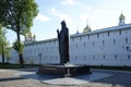 Statue of Saint Sergius of Radonezh at the wall of Trinity Lavra of St. Sergius. Sunny summer view.
