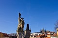 The statue of saints on the Charles Bridge with Prague Castle in the background Czech Republic Royalty Free Stock Photo