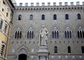 Statue of Sallustio Bandini 1677 - 1760, a priest and one of the first Italian economists, at Piazza Salimbeni, Siena, Italy Royalty Free Stock Photo