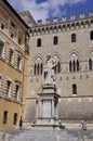 Statue of Salustio Bandini Monument from Piazza Salimbeni Square of Siena Medieval City. Tuscany. Italy Royalty Free Stock Photo