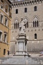 Statue of Salustio Bandini Monument from Piazza Salimbeni Square of Siena Medieval City. Tuscany. Italy Royalty Free Stock Photo