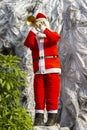 Statue Of Santa Claus Blowing Trumpet For Decoration On Christmas Holiday. Royalty Free Stock Photo
