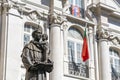 statue of santo antonio on the left side with the church of santo antonio in the background on the right side, lisbon Royalty Free Stock Photo