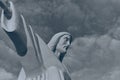 Statue sculpture of Jesus Christ the Savior. Background of gray sky and white clouds. Black and white photo. Royalty Free Stock Photo