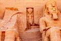 Statue of seated pharaoh Ramesses II and Ra Horakhty at The Great Temple of Rameses II Royalty Free Stock Photo