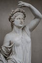 Statue of sensual Roman renaissance era woman in circlet of bay