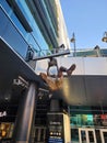 A statue of Shaquille O\'Neal dunking a basketball a Lakers uniform in front of Crypto.com Arena in Los Angeles California