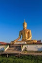 The statue of sitting Buddha in Bangkok Thailand with blue sky Royalty Free Stock Photo