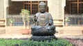 Statue of the sitting buddha placed in the park. Royalty Free Stock Photo